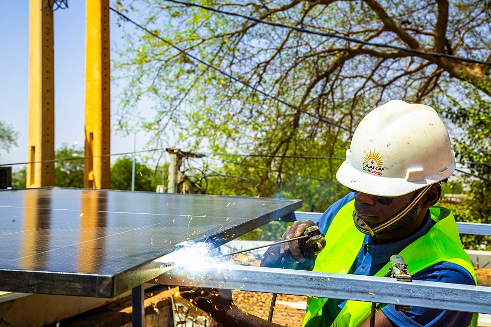 Taaka-SolarEnergy employee welding parts