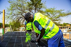 Taaka-SolarEnergy employee welding solar panels