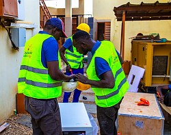 Taaka-SolarEnergy employee unpacking solar parts