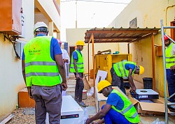 Taaka-SolarEnergy employee unpacking solar parts